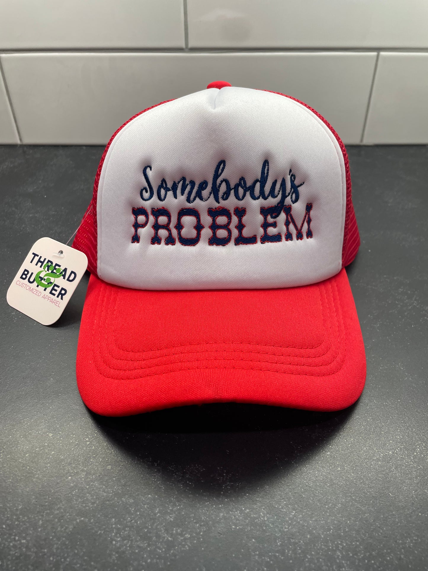 Somebody’s Problem Trucker Hat
