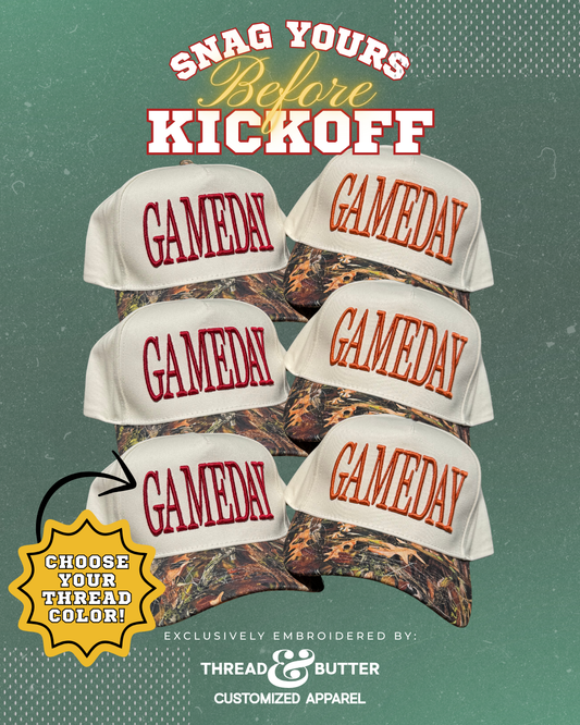 GAMEDAY Puff Embroidered Hat on Canvas Trucker with Camo Bill